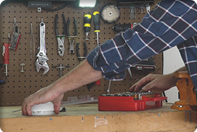 Man using batteries with his tools